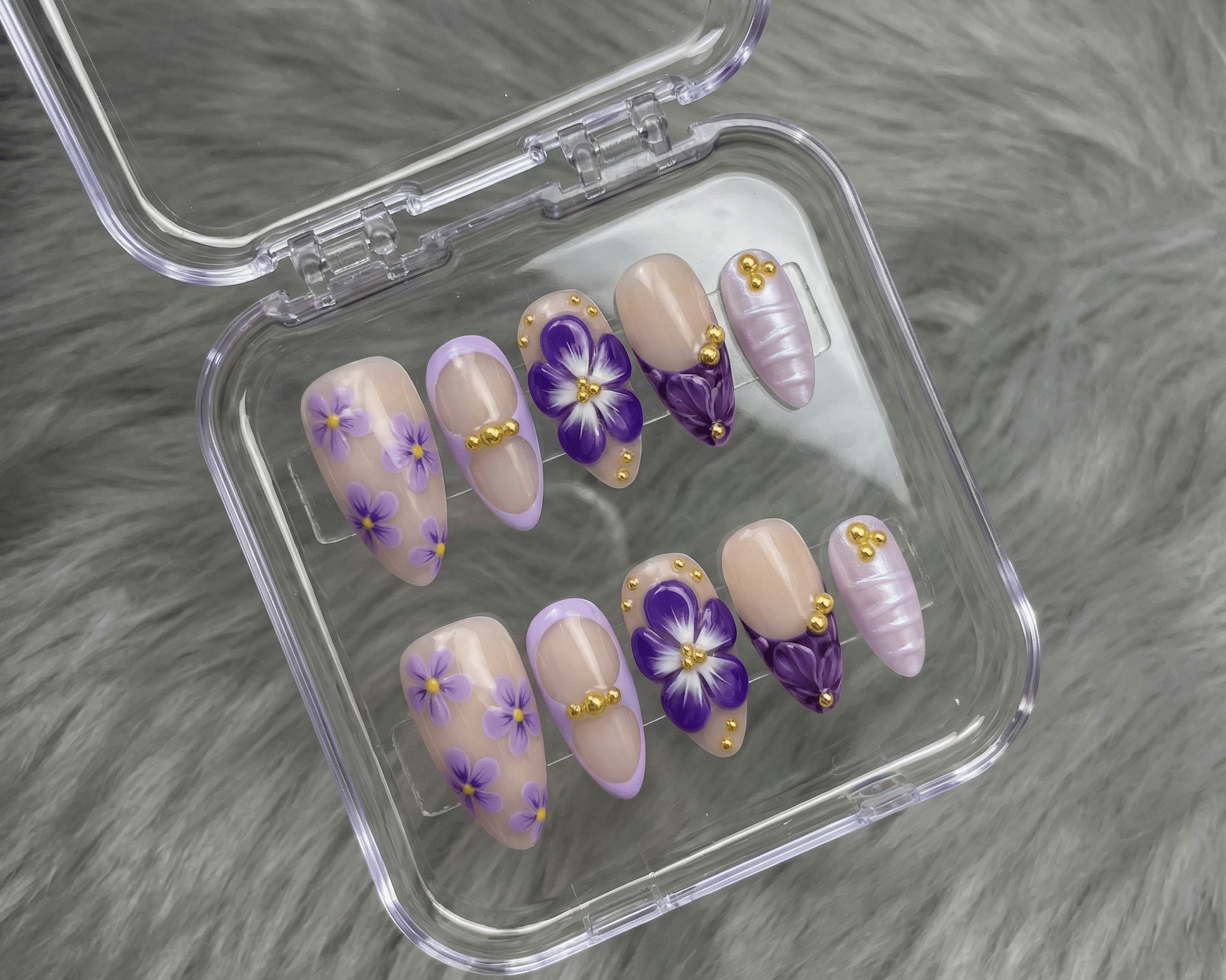 Hand-painted almond press-on nails by Handora