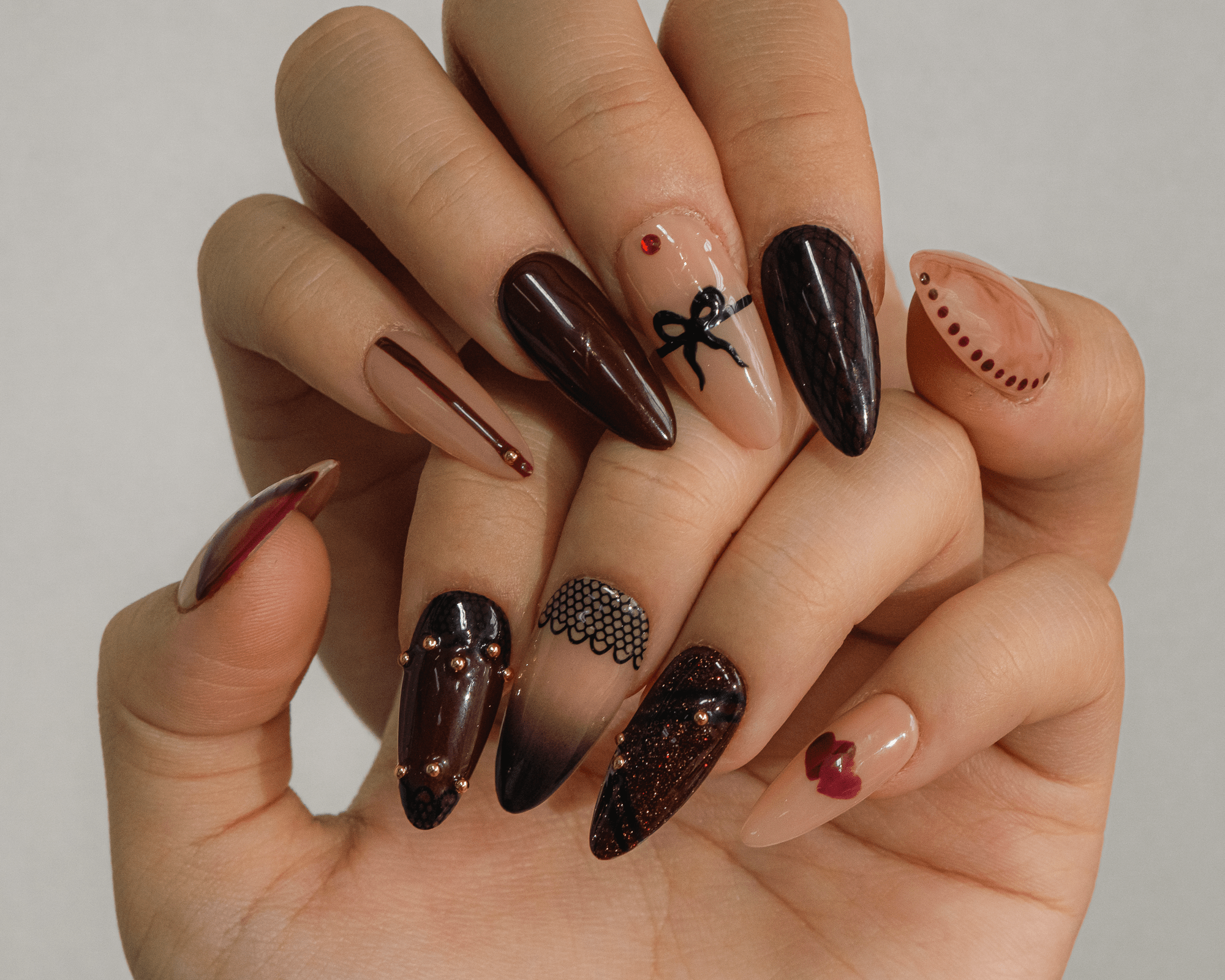 Hand-painted fall press-on nails by Handora