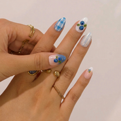 Berry Picnic press-on nails worn on hand – almond shape by Handora