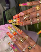 Papaya Bliss press-on nails worn on hand – coffin shape by Handora