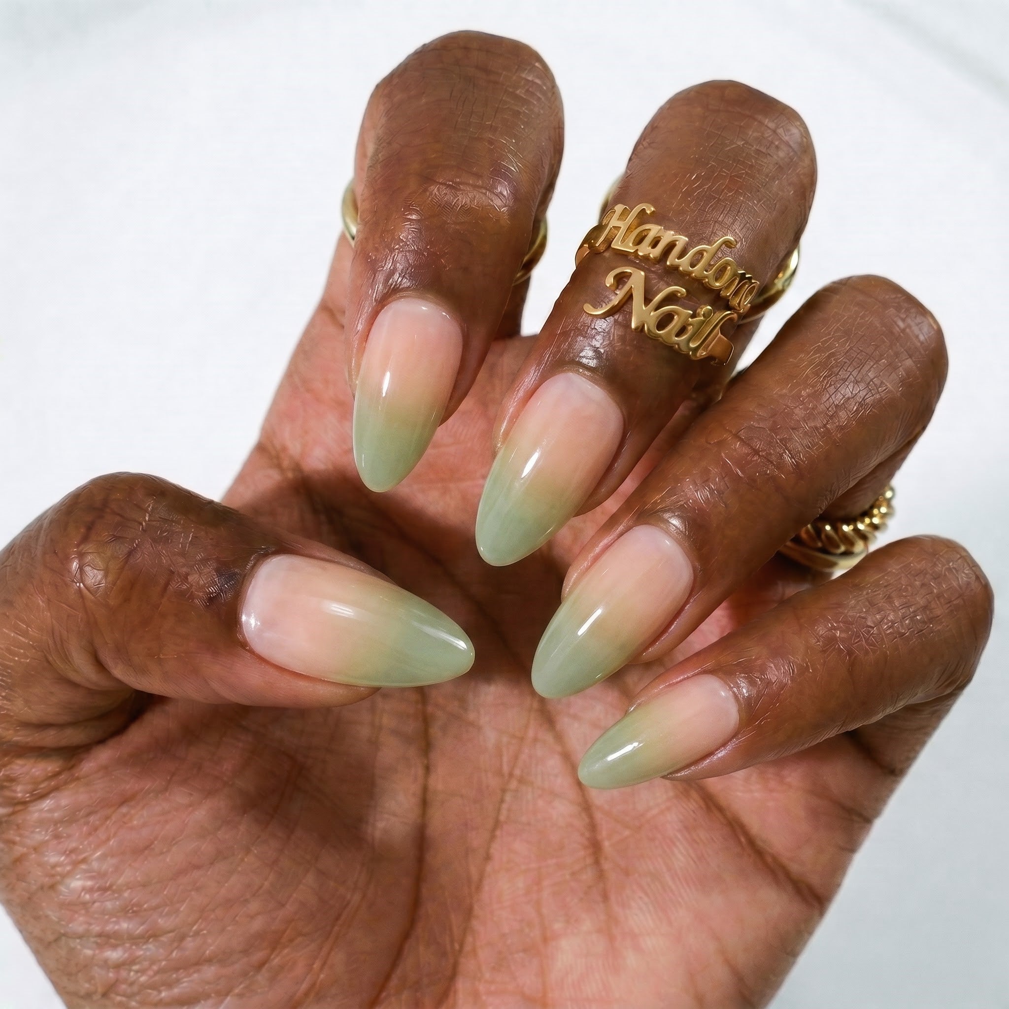 Apply_gradient_nails_to_hand_202607301500.jpg