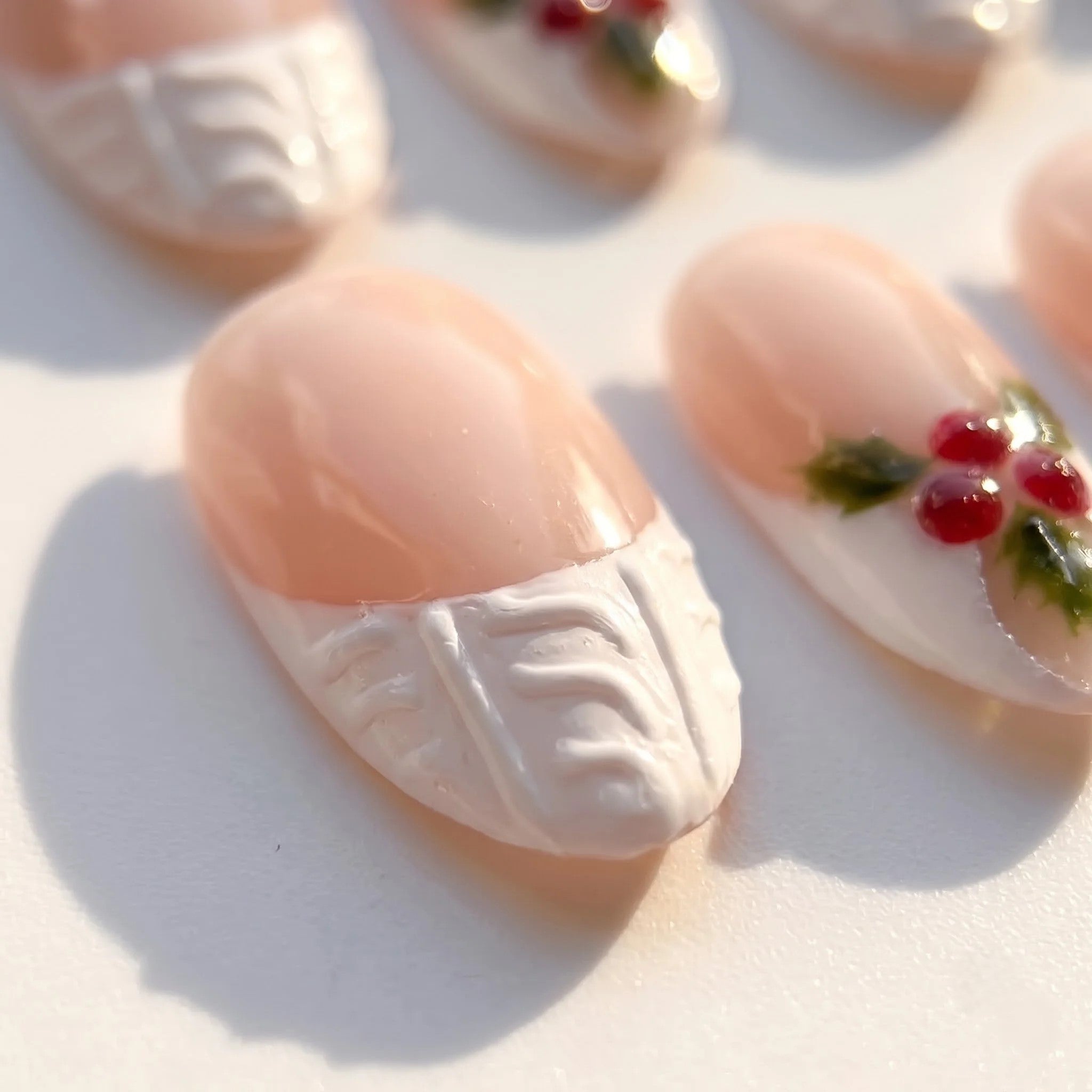Berry Knit christmas press-on nails – close-up by Handora Nails