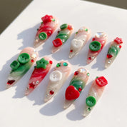 Button Knit christmas press-on nails – flat lay and packaging by Handora Nails