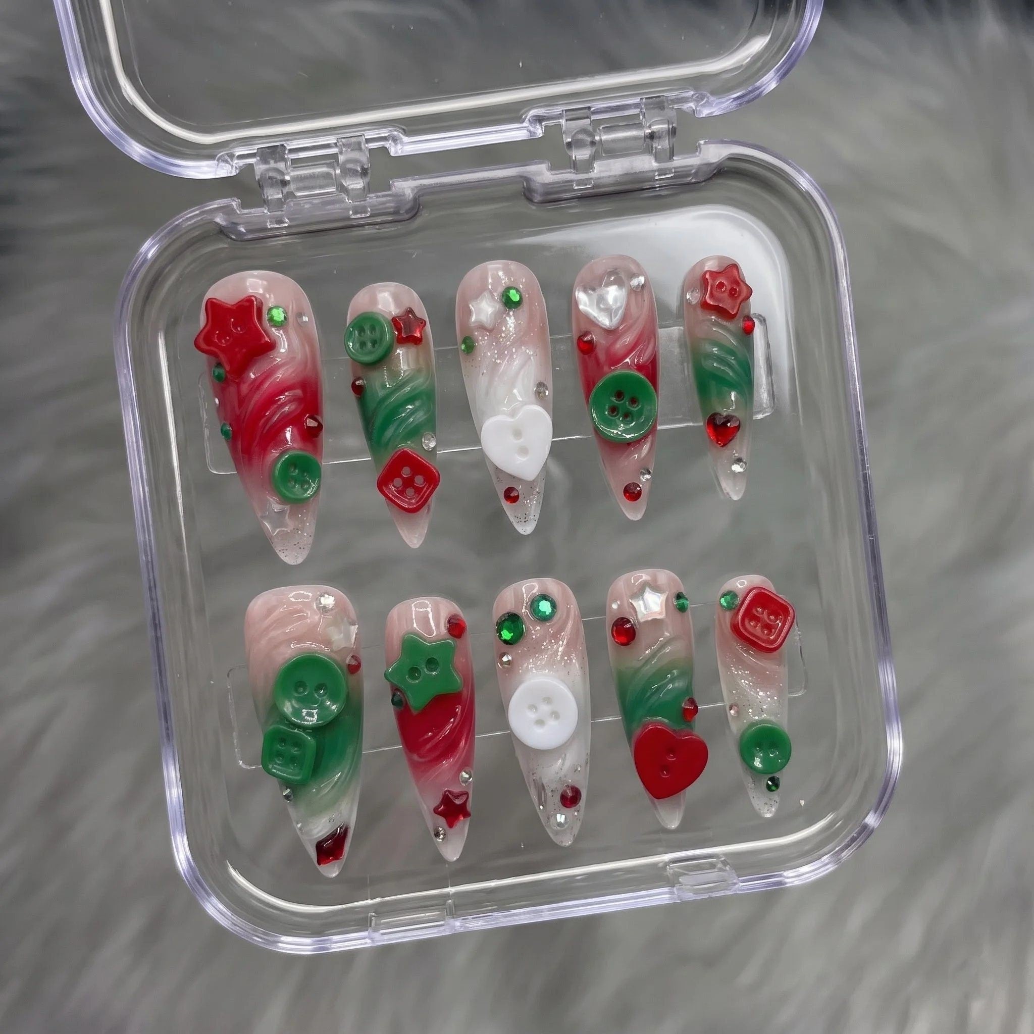 Button Knit christmas press-on nails – flat lay and packaging by Handora Nails