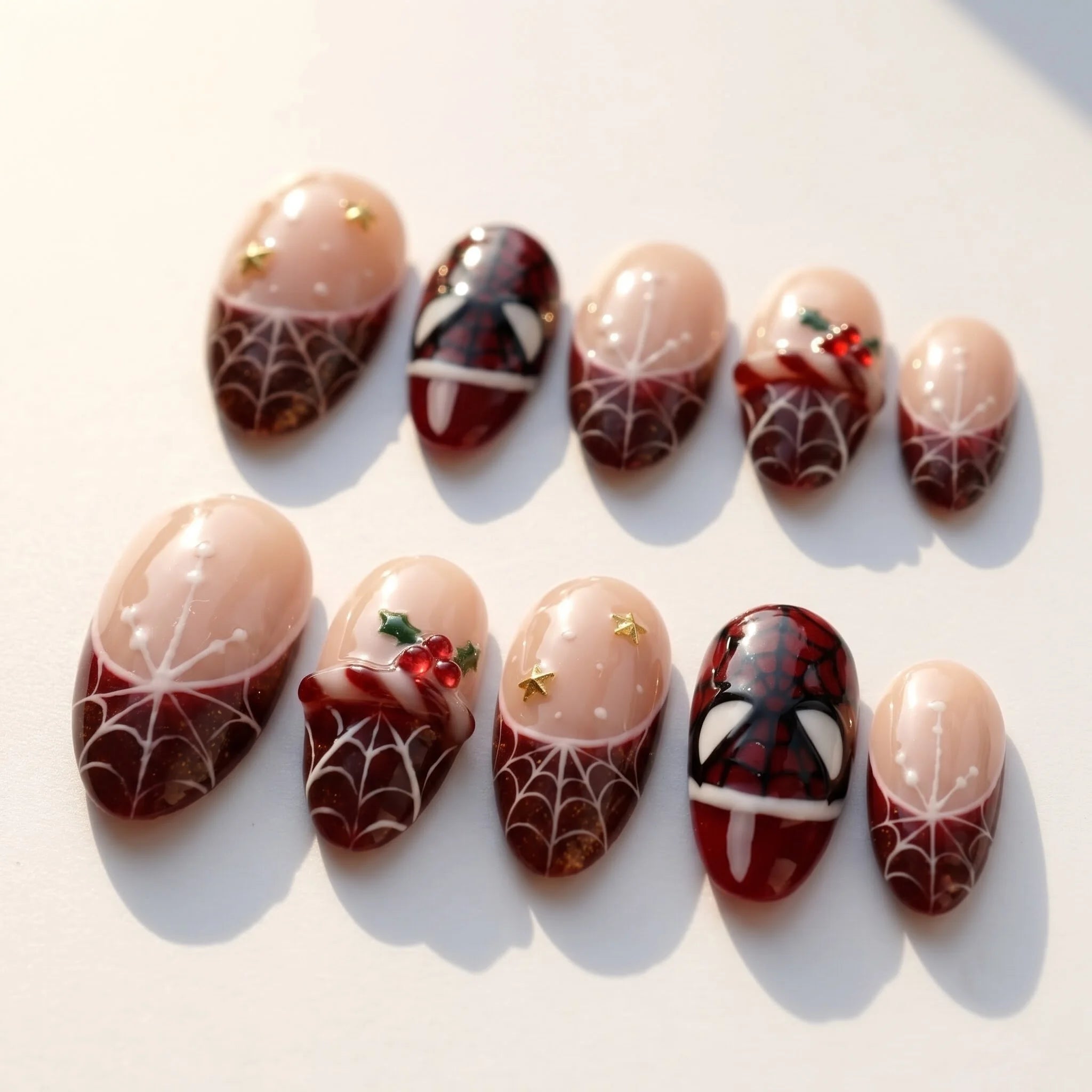 Crimson Web Christmas press-on nails – flat lay by Handora Nails