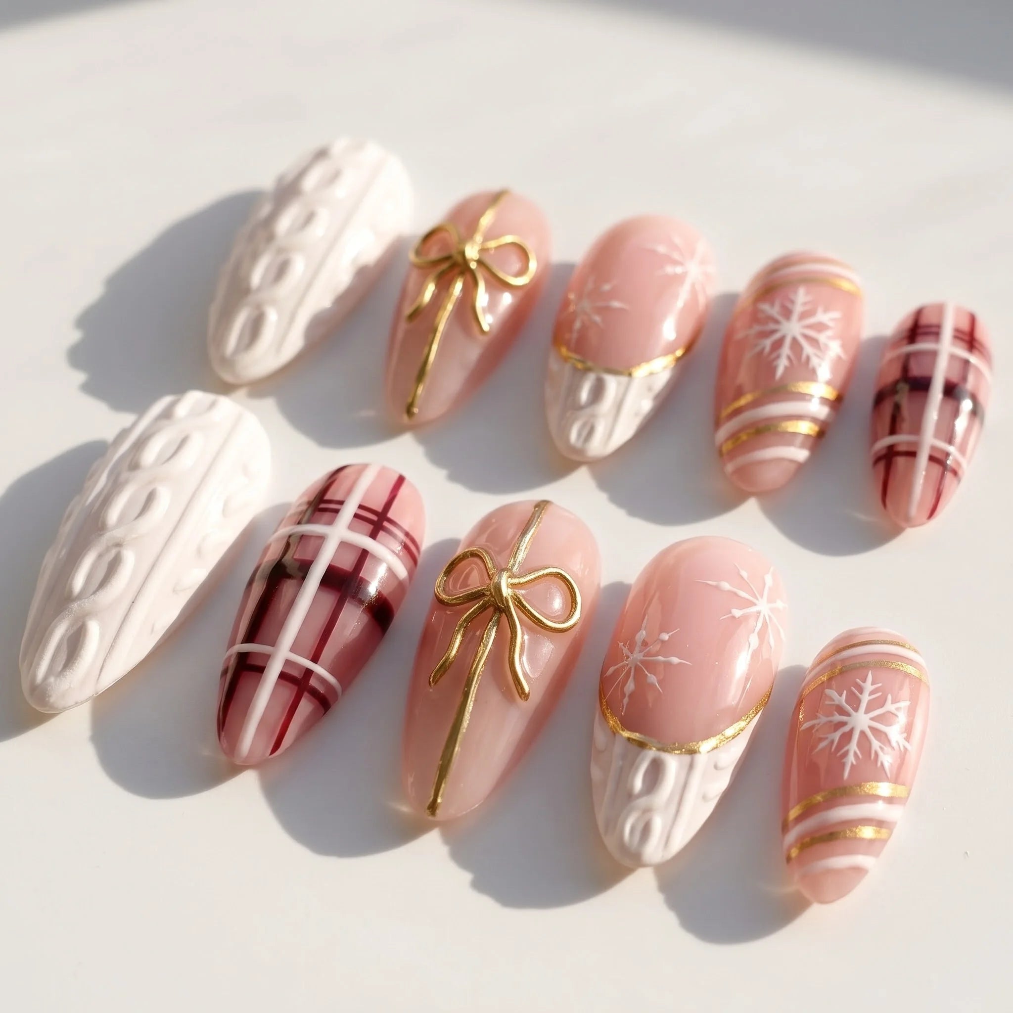 Gift Wrapped Christmas Sweater press-on nails – flat lay by Handora Nails