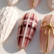 Gift Wrapped Christmas Sweater press-on nails – close-up by Handora Nails
