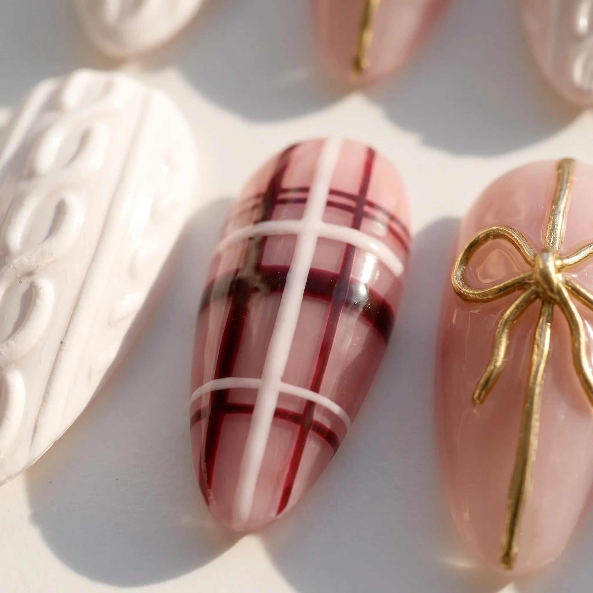 Gift Wrapped Christmas Sweater press-on nails – close-up by Handora Nails