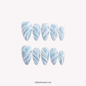 Glacial Ribbon Christmas press-on nails - white background by Handora Nails