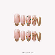 Golden Gift Christmas press-on nails - white background by Handora Nails