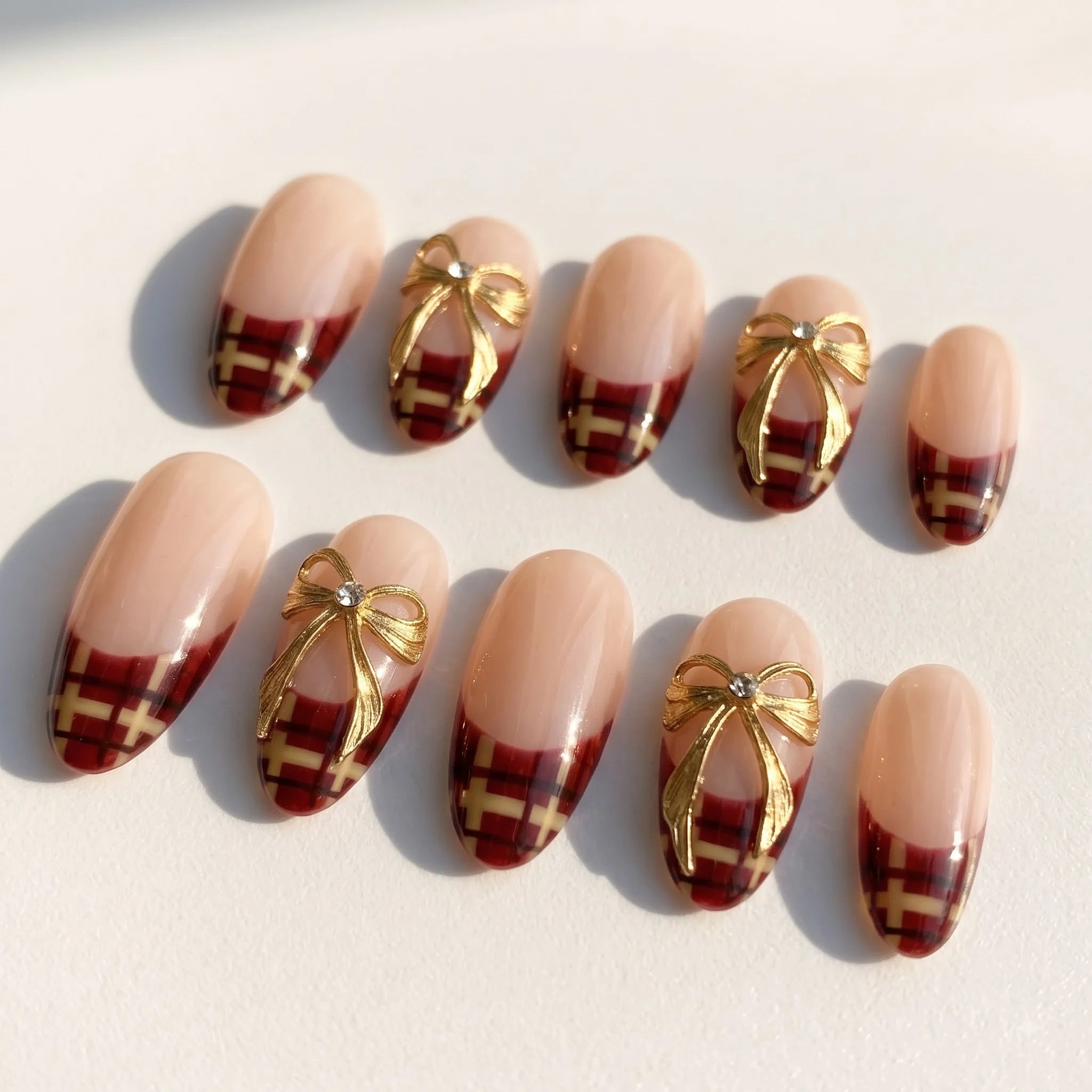 Golden Ribbon Plaid French press-on nails – flat lay by Handora Nails