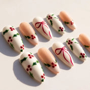 Holly Berry Christmas press-on nails – flat lay by Handora Nails