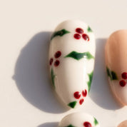 Holly Berry Christmas press-on nails – close-up by Handora Nails