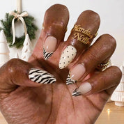 Ivory Zebra winter press-on nails - on hand by Handora Nails