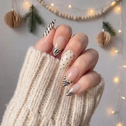 Ivory Zebra winter press-on nails - on hand by Handora Nails