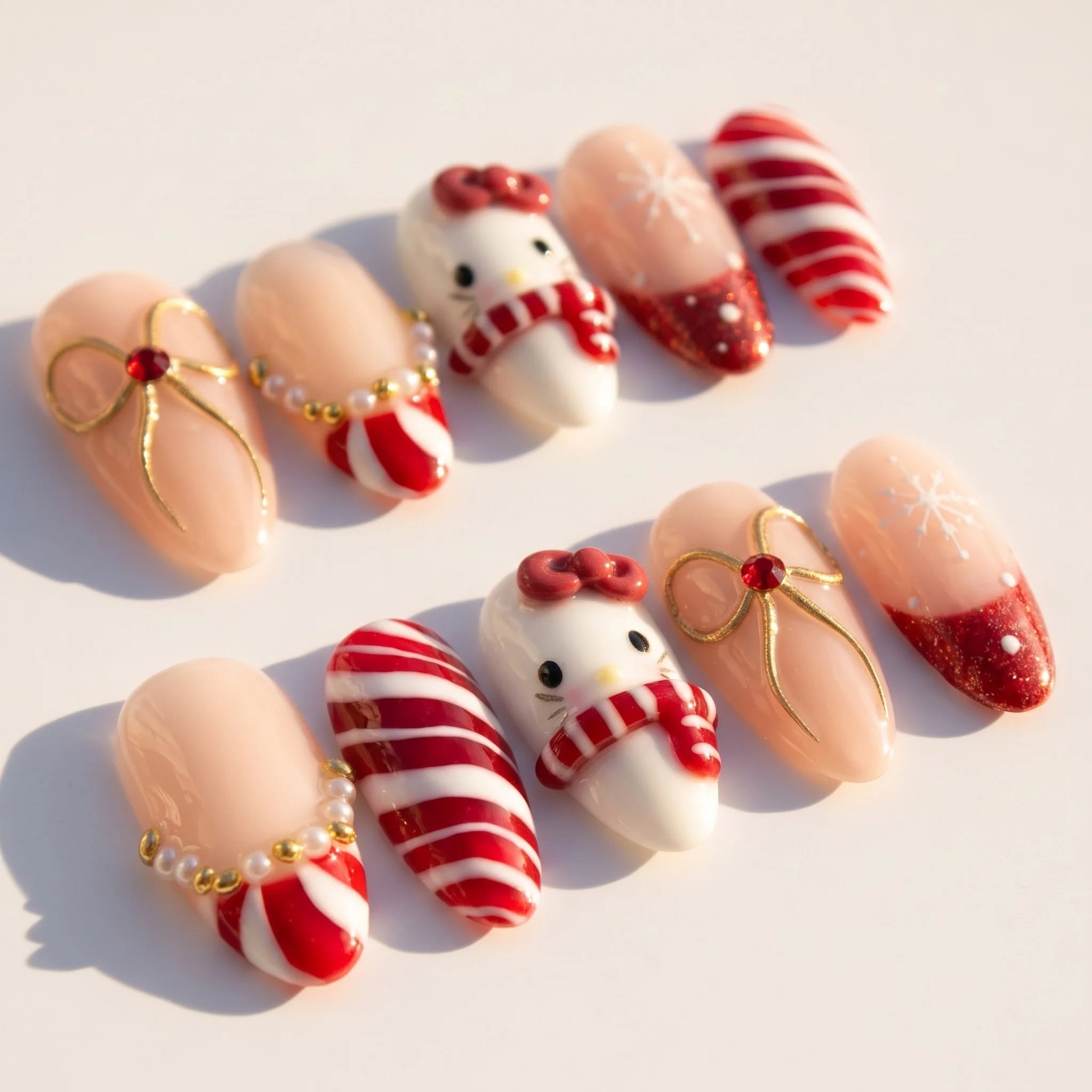 Merry Kitty Candy Cane press-on nails – flat lay by Handora Nails