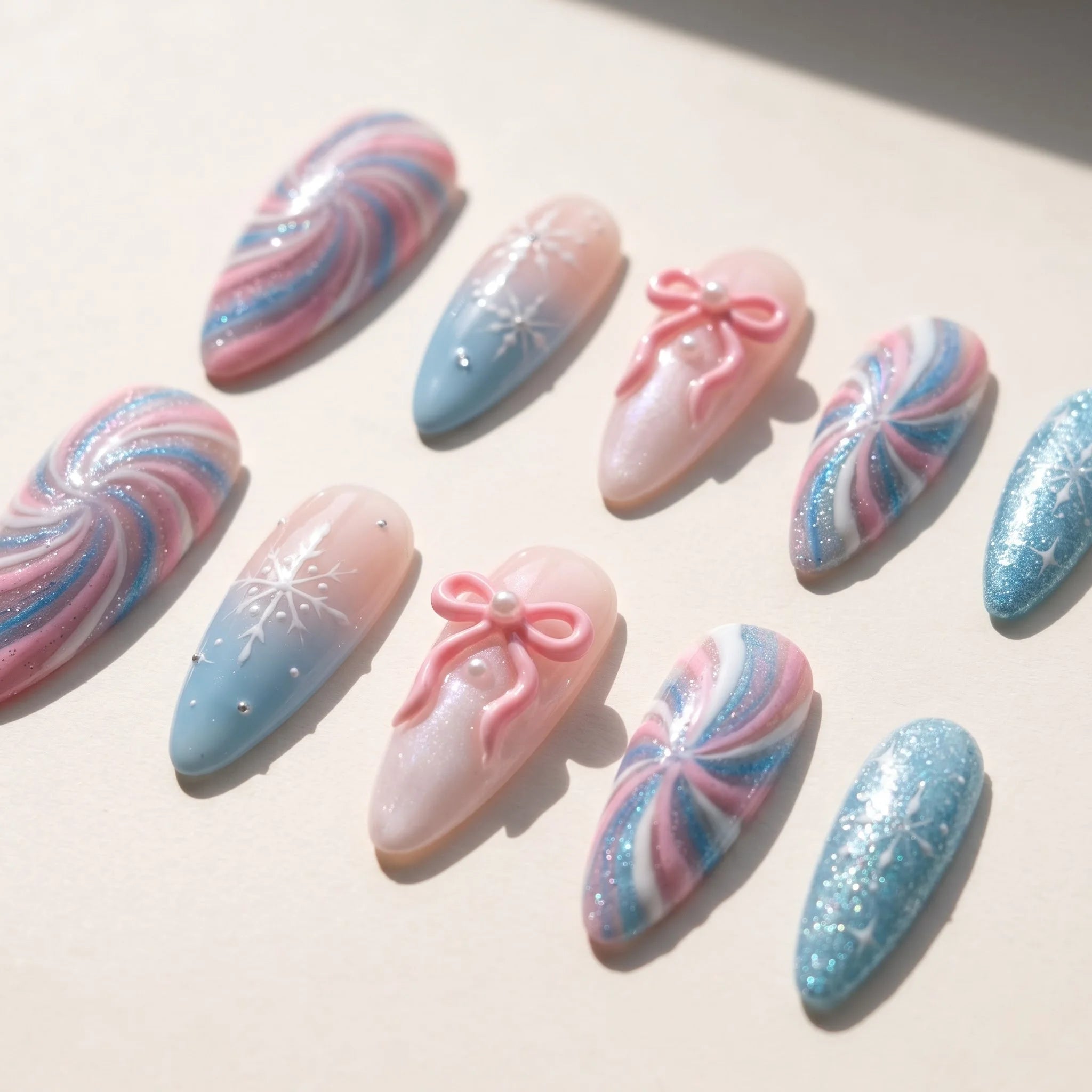 Pastel Snowflake winter press-on nails – flat lay and packaging by Handora Nails