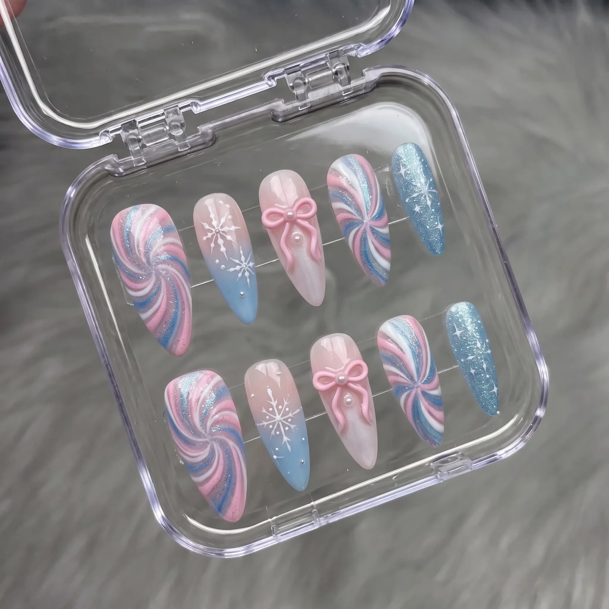 Pastel Snowflake winter press-on nails – flat lay and packaging by Handora Nails