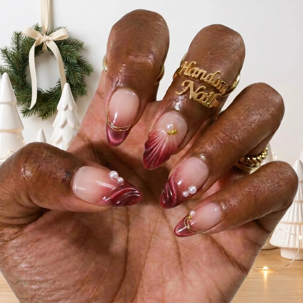 Ruby Tide Christmas press-on nails - on hand by Handora Nails