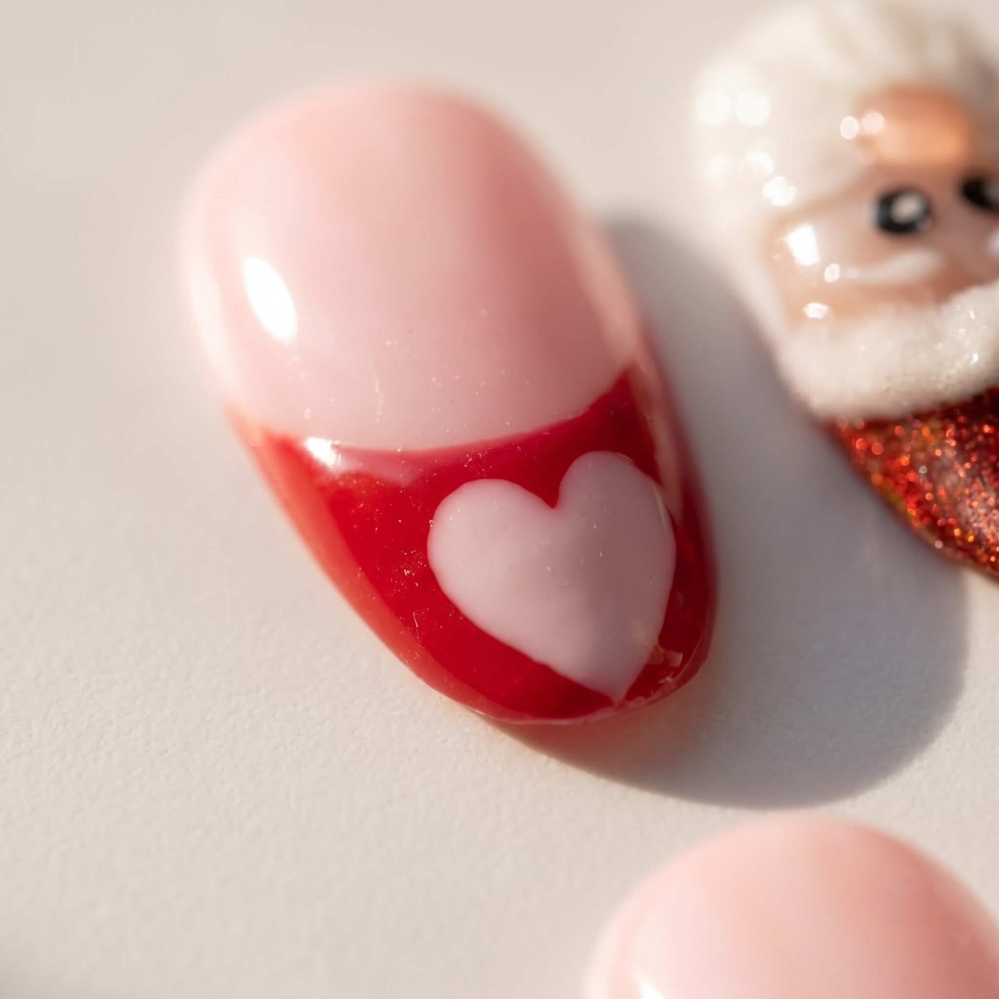 Santa Pop christmas press-on nails – close-up by Handora Nails