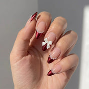 Santa's Bow Chrome French press-on nails – on hand by Handora Nails