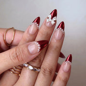 Santa's Bow Chrome French press-on nails – on hand by Handora Nails