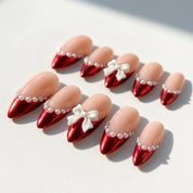 Santa's Bow Chrome French press-on nails – flat lay by Handora Nails