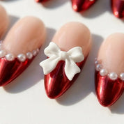 Santa's Bow Chrome French press-on nails – close-up by Handora Nails