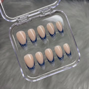 Winter Midnight snowflake press-on nails – flat lay and packaging by Handora Nails