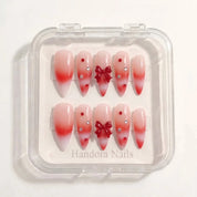 Woolen Bow christmas press-on nails – white background by Handora Nails