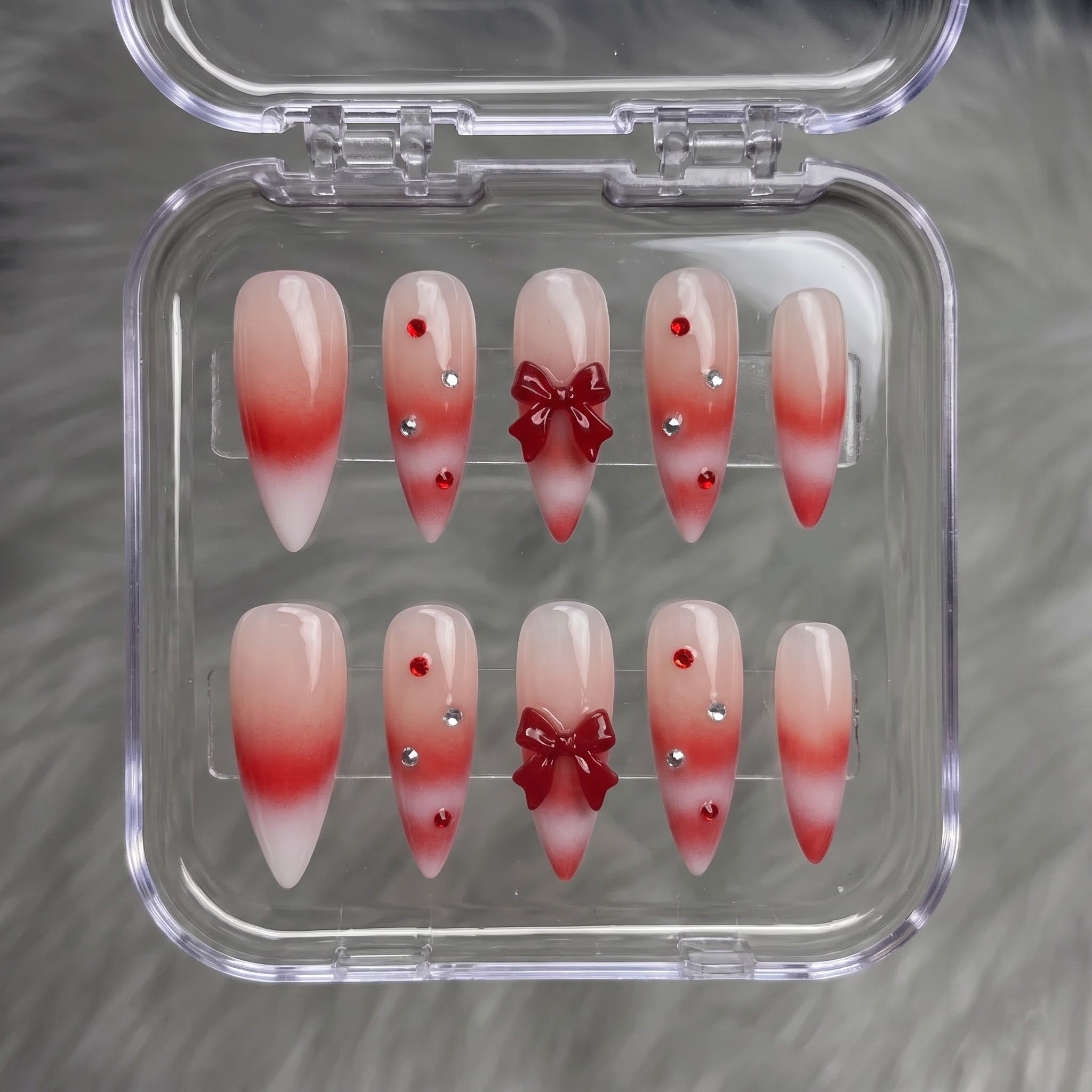 Woolen Bow christmas press-on nails – flat lay and packaging by Handora Nails