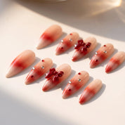 Woolen Bow christmas press-on nails – flat lay and packaging by Handora Nails