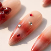 Woolen Bow christmas press-on nails – close-up by Handora Nails
