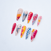 Abstract Bloom press-on nails worn on hand – almond shape by Handora