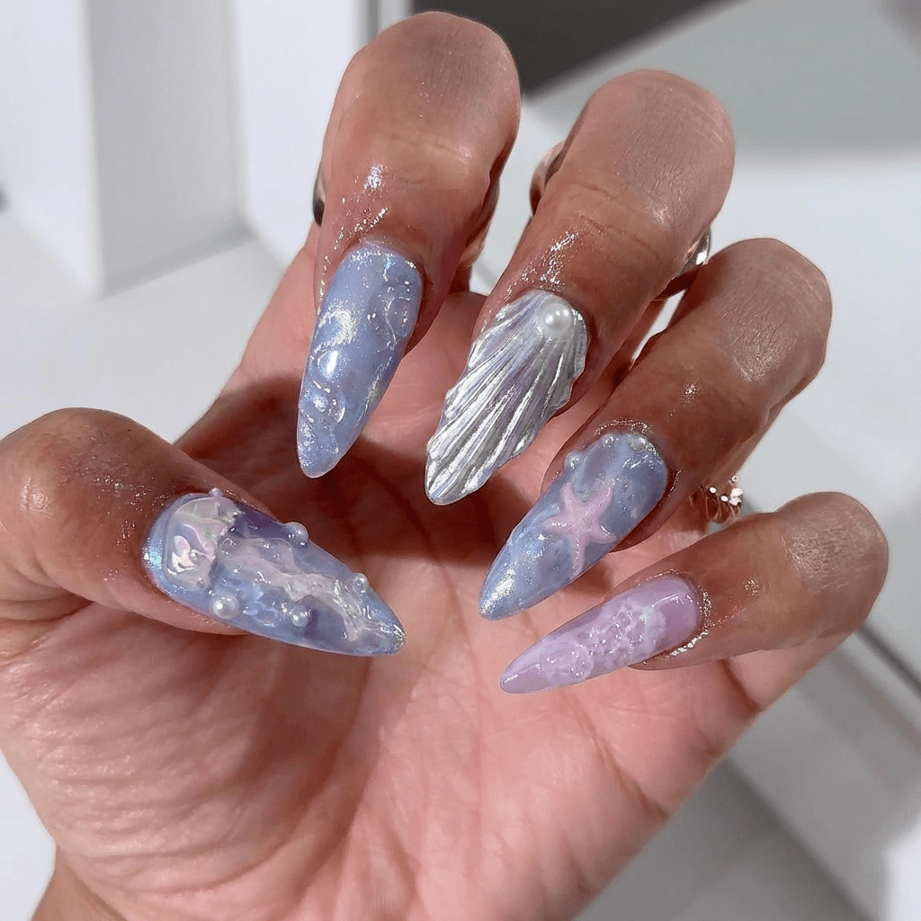Aetheric Tide press-on nails worn on hand – almond shape by Handora