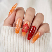 Amber Flare press-on nails worn on hand – coffin shape by Handora