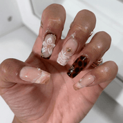 Amber Flora press-on nails – hand-painted reusable gel set by Handora