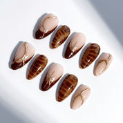 Amber Radiance almond press-on nails – design close-up by Handora