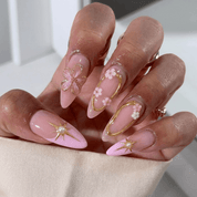 Amethyst Stars press-on nails worn on hand – stiletto shape by Handora