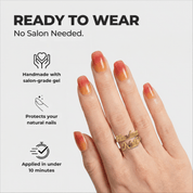 Apple Blush press-on nails worn on hand – almond shape by Handora