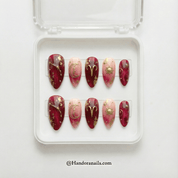 Aries Radiant press-on nails worn on hand – almond shape by Handora