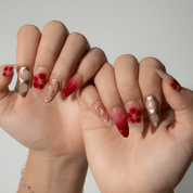Autumn Bloom press-on nails worn on hand – almond shape by Handora