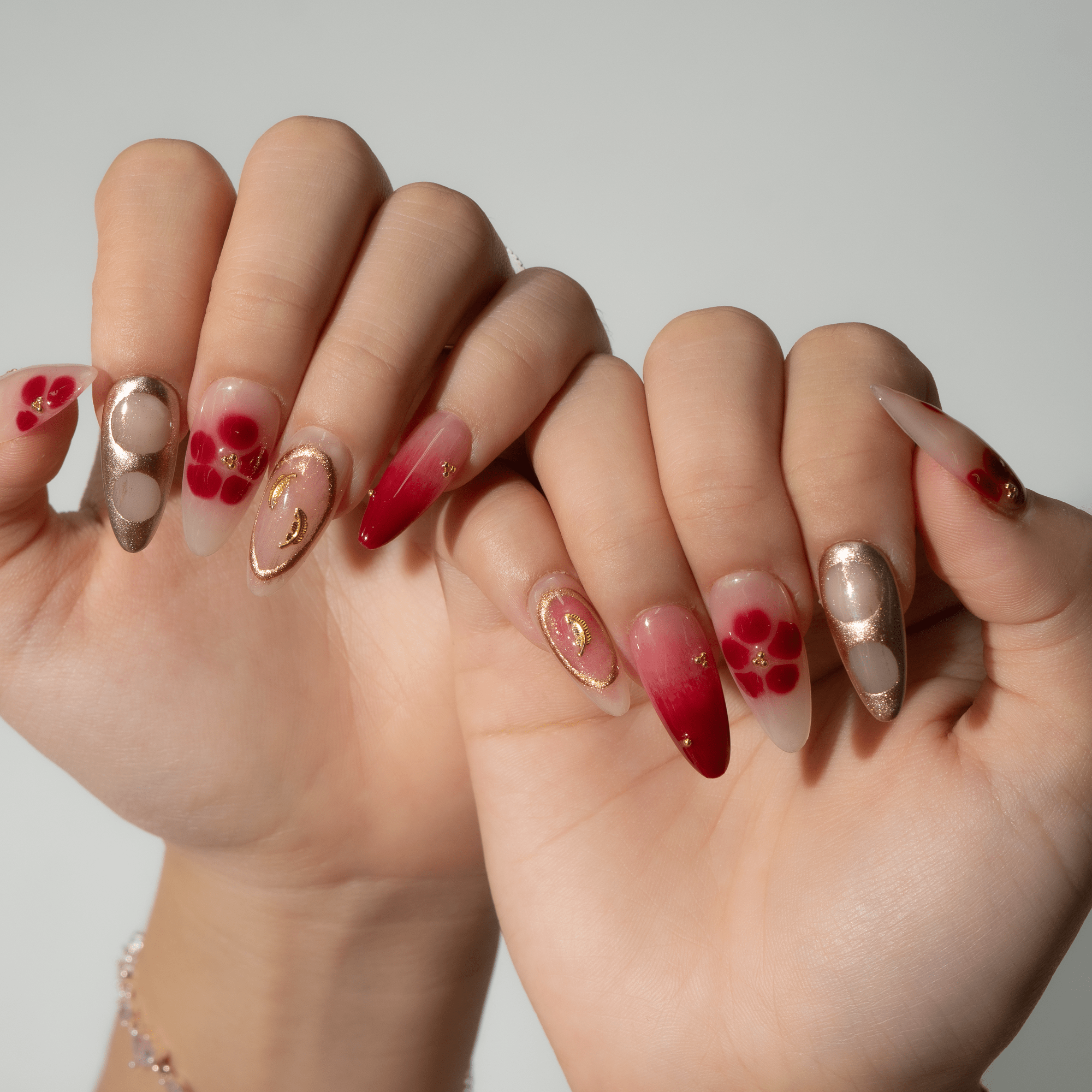 Autumn Bloom press-on nails worn on hand – almond shape by Handora