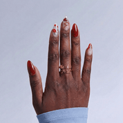 Autumn Leaves press-on nails worn on hand – almond shape by Handora