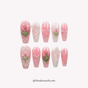Azure Blossom press-on nails worn on hand – almond shape by Handora