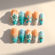 Azure Dewdrop press-on nails worn on hand – almond shape by Handora