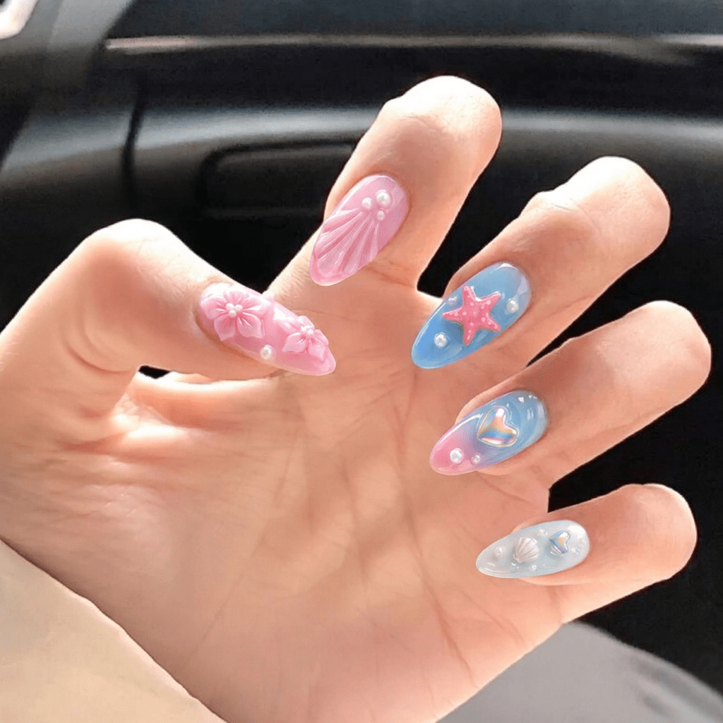 Azure Reef press-on nails worn on hand – almond shape by Handora