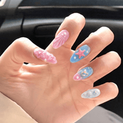 Azure Reef press-on nails worn on hand – almond shape by Handora