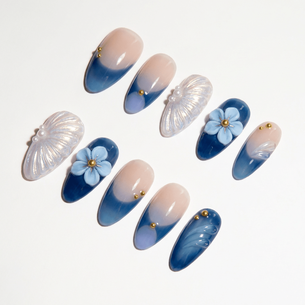Azure Shell press-on nails worn on hand – almond shape by Handora