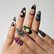 Beetle Glitz press-on nails worn on hand – almond shape by Handora